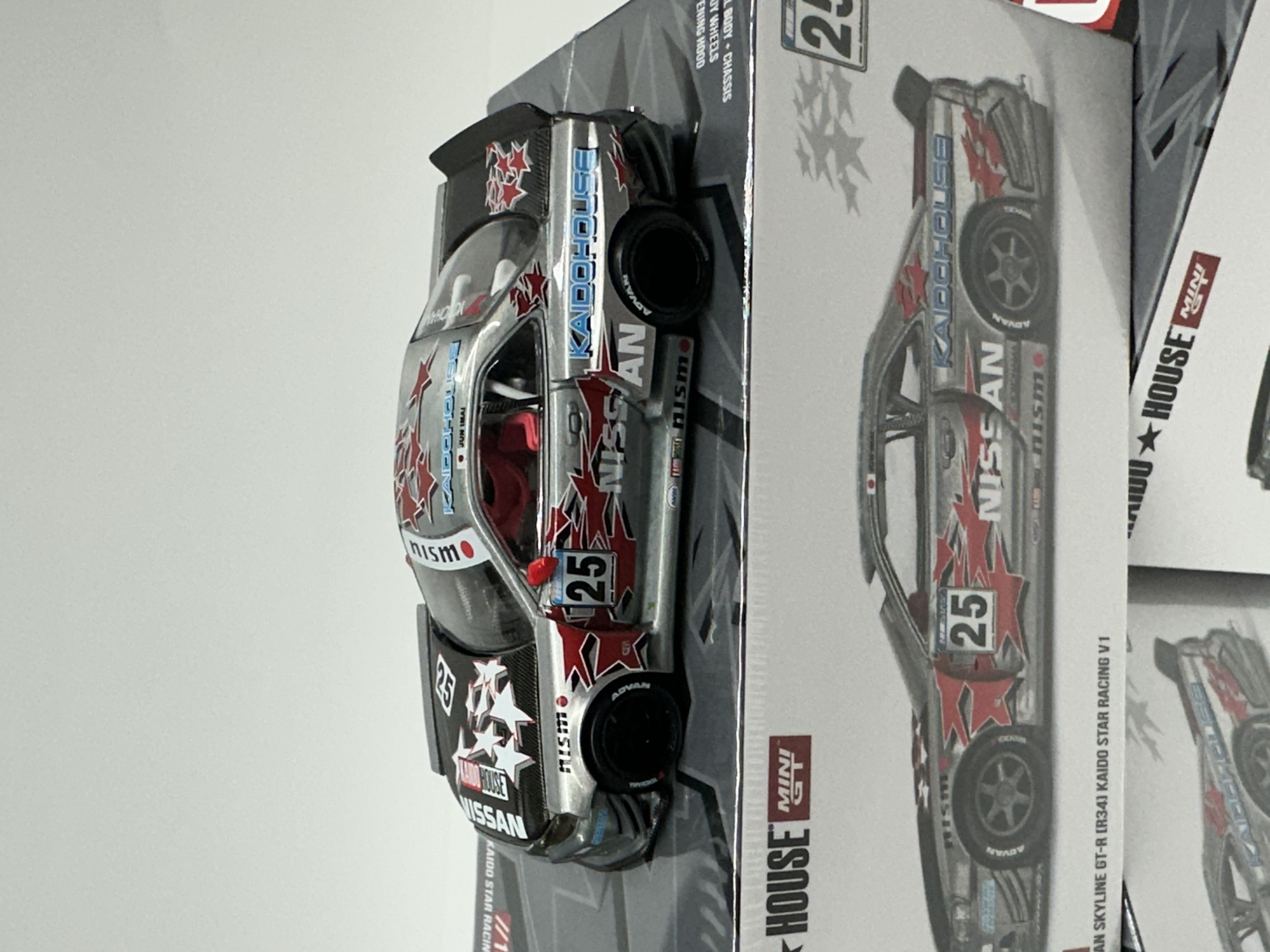 MINI GT Kaido House KHMG197 Nissan Skyline GT-R (R34) — Kaido Star Racing V1 #25 Raw Metal Chase — CHASE